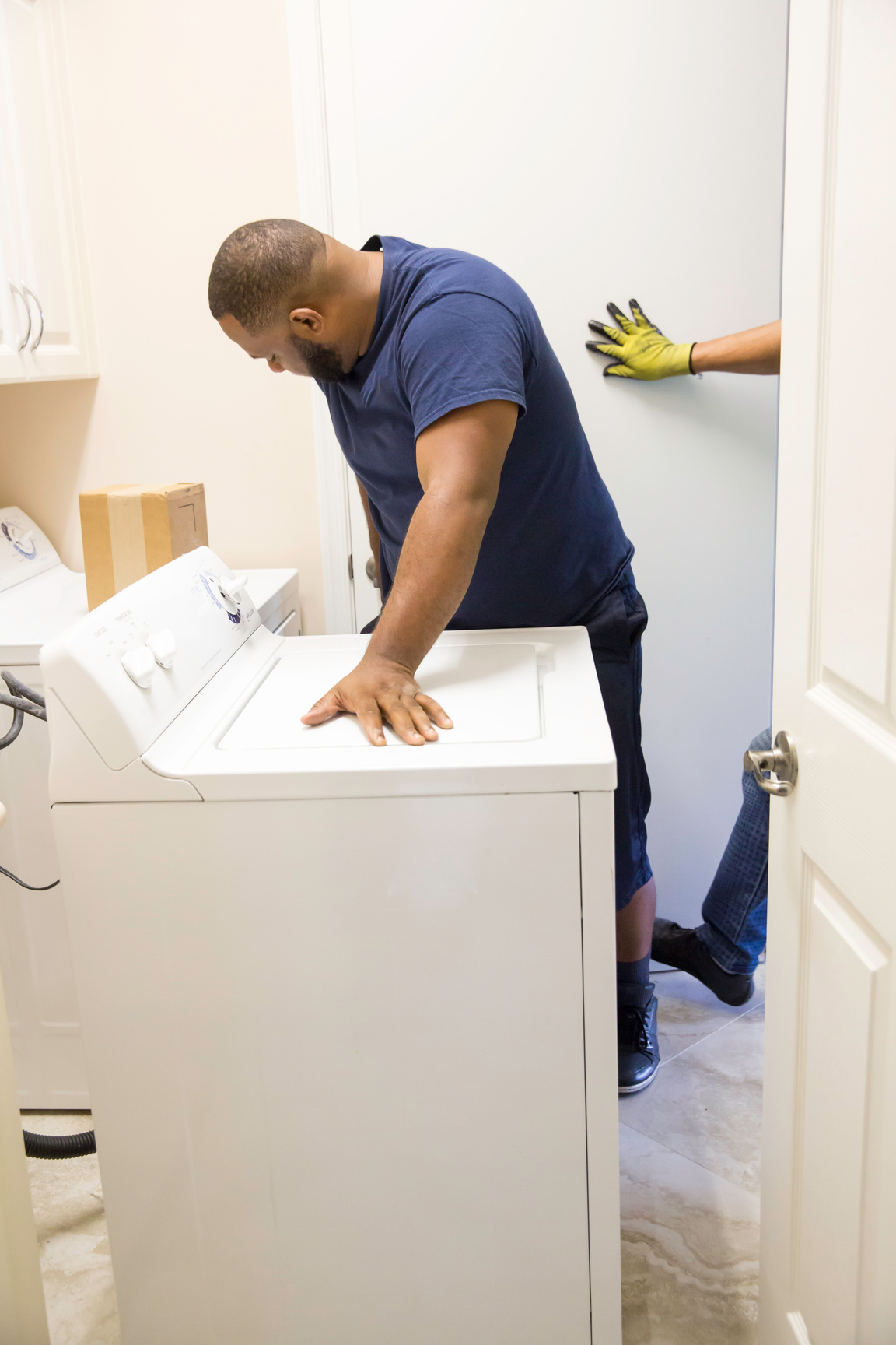 Series- Removing old washer and dryer in laundry room